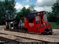 "I knew we shouldn't have parked here", is what I'm sure many people have jokingly said as they look at derelict ex-CN 1311 sitting in the Rail Link yard in Hamilton.  Back in 2011 the unit has been raped of all usuable parts and is going to be scrapped, but being from Windsor it almost looks like someone left it on a street in Detroit!!