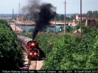 Trillium Railway #110, an ex-CN MLW S13, throttles up to climb the grade on the former CN Thorold Subdivision with their short lived diner train.  I believe that the passenger cars went back to the New York & Lake Erie after this endeavor was abandoned.