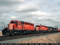 A westbound CP freight sits at Jefferson Ave. in Windsor, Ontario with CP 5658 in command.  For added interest today we have Wheeling and Lake Erie, ex-DRGW obviously, SD40T-2's #5413 and 5391 in the consist.  These Tunnel Motors made a couple trips through Windsor back in 2004, and I was glad I was able to get a 'sucker hole' in the clouds so I could nab a decent shot of them at the time.