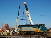 Getting a 'lift' is VIA F40PH-2 #6403 after having a traction motor fail on it's trip down to Windsor in the days prior.  Here a crew is placing a 'dummy' axle in place of the failed traction motor to allow train #76 to tow the unit on the rear of it's train back to Toronto later in the day.  Seems #6403, now #6459, made it into my view finder more often than I realized as I keep finding more and more photos of it.
