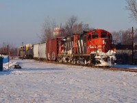 Two elderly EMD 'Geeps' haul the daily London bound freight through Essex on the historic Canada Southern. At the time this power was rare for this train, taking a break from the normal fleet of SD70's and SD75i's that were so common on 438/439. Today however, this is normal power for this train as CN has agreed with VIA to put at least two units on the front in case of mechanical failure, which has happened before. These rails are long gone and CN is now using VIA's Chatham sub to gain access to Windsor.