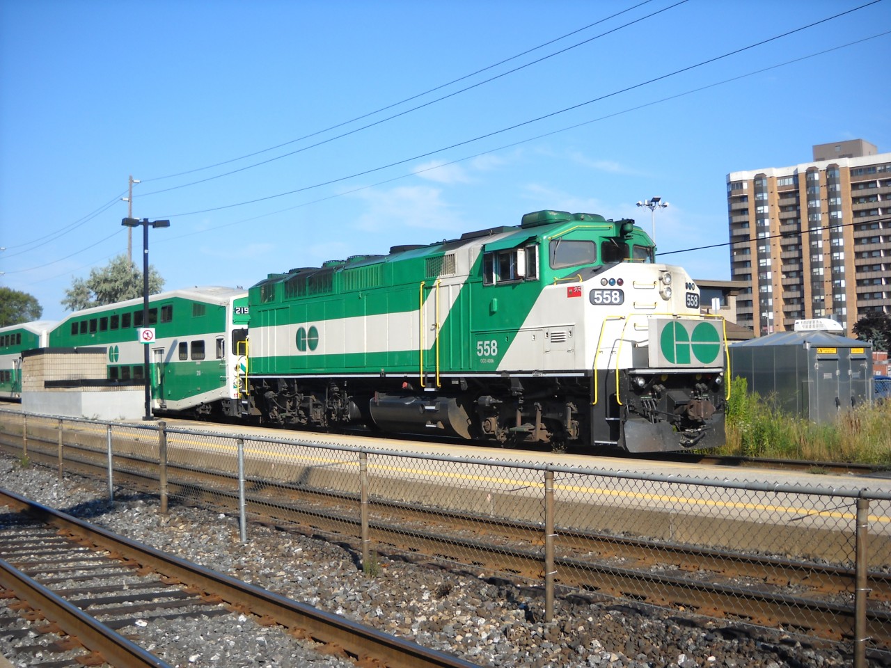  RevEd Photo: GO F59PH #558 is pushing an eastbound GO  train out of Long Branch station on the evening of August 18th 2013. #558  is operating at the end of
