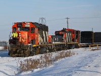 It's a cold job in December. GP38-2 CN 7518, YBU-4m yard slug 526 and GMD1 1421 switching at Clover Bar Yard in East Edmonton.