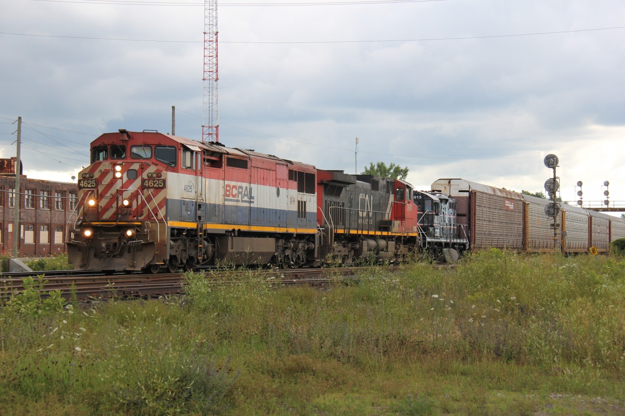 CN 434 rolls into Paris to do some work with BCOL 4625, CN 2648 and CCGX 4015 on a quiet Sunday afternoon in the summer. The trailing unit (CCGX 4015) said "Cando" on it; not sure where this locomotive was destined for.