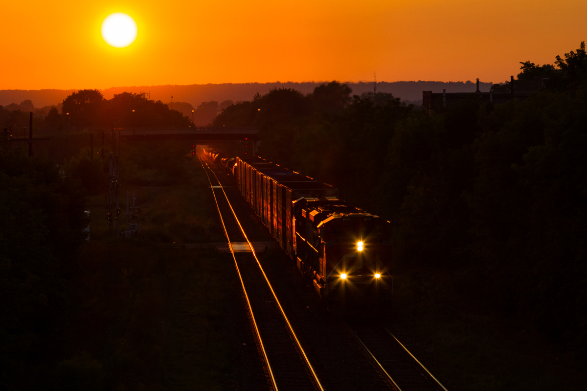 Fleeting Moments of Summer  After working Stuart Street Yard and waiting for some congestion around Jordan to clear up, CN 330 charges out of Hamilton with CN 8897 and BCOL 4646 doing the honours. This wonderful sunset brought an excellent day trackside to a close.