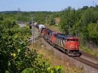 <b> Quadruple 5 eastbound at Hamilton West. </b> EMD SD60F, # 5555 leads train 382 towards Toronto at Hamilton West with a decent lashup on a wonderful late August morning. Thanks to a timely heads-up, I was able to squeeze in getting a shot of this great train before starting my 12 'o clock shift at Staples up the hill in Waterdown.