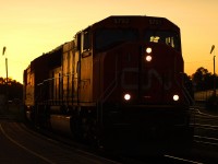 CN 5792, along with two other "cowl" units leading an Eastbound past Brantford in the last light of the day