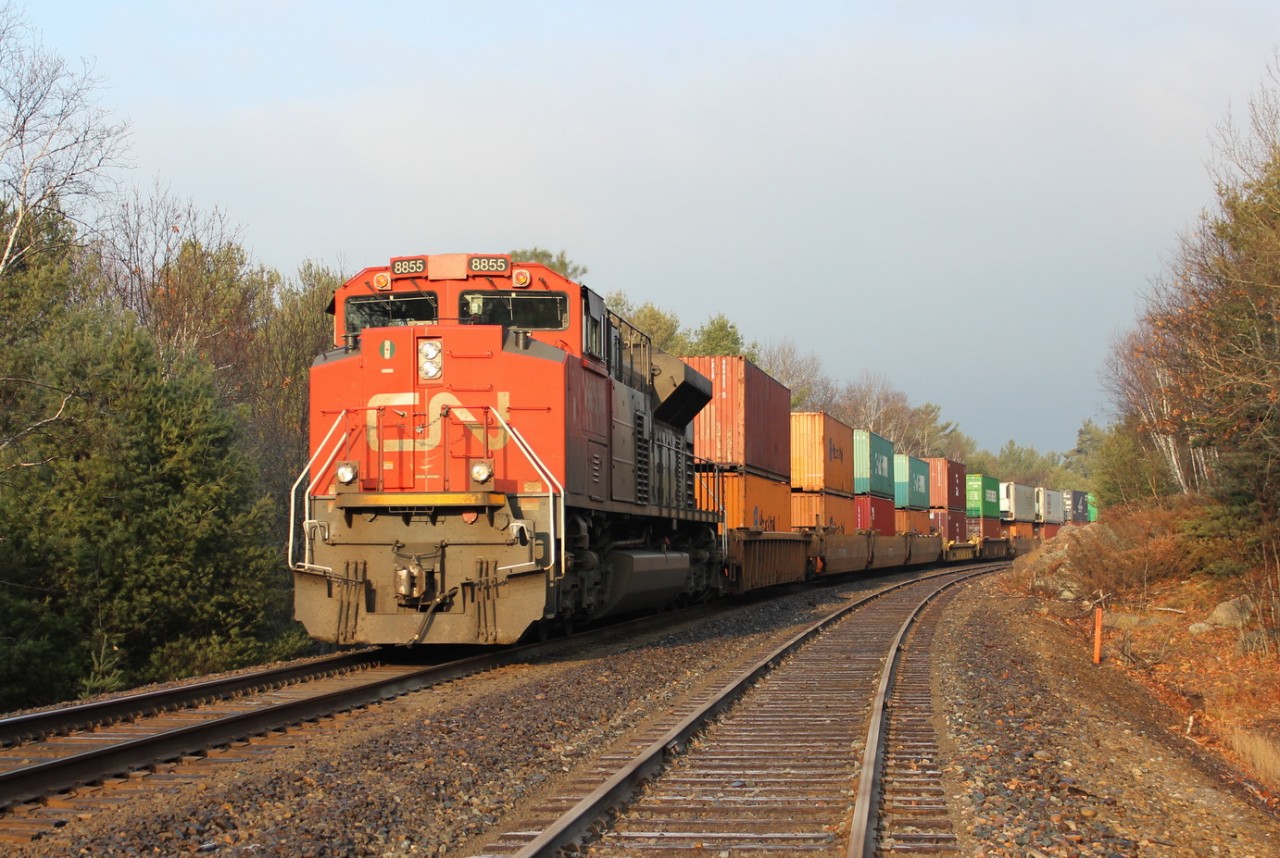 CN 8855 shoves on the rear on a long westbound intermodal train.