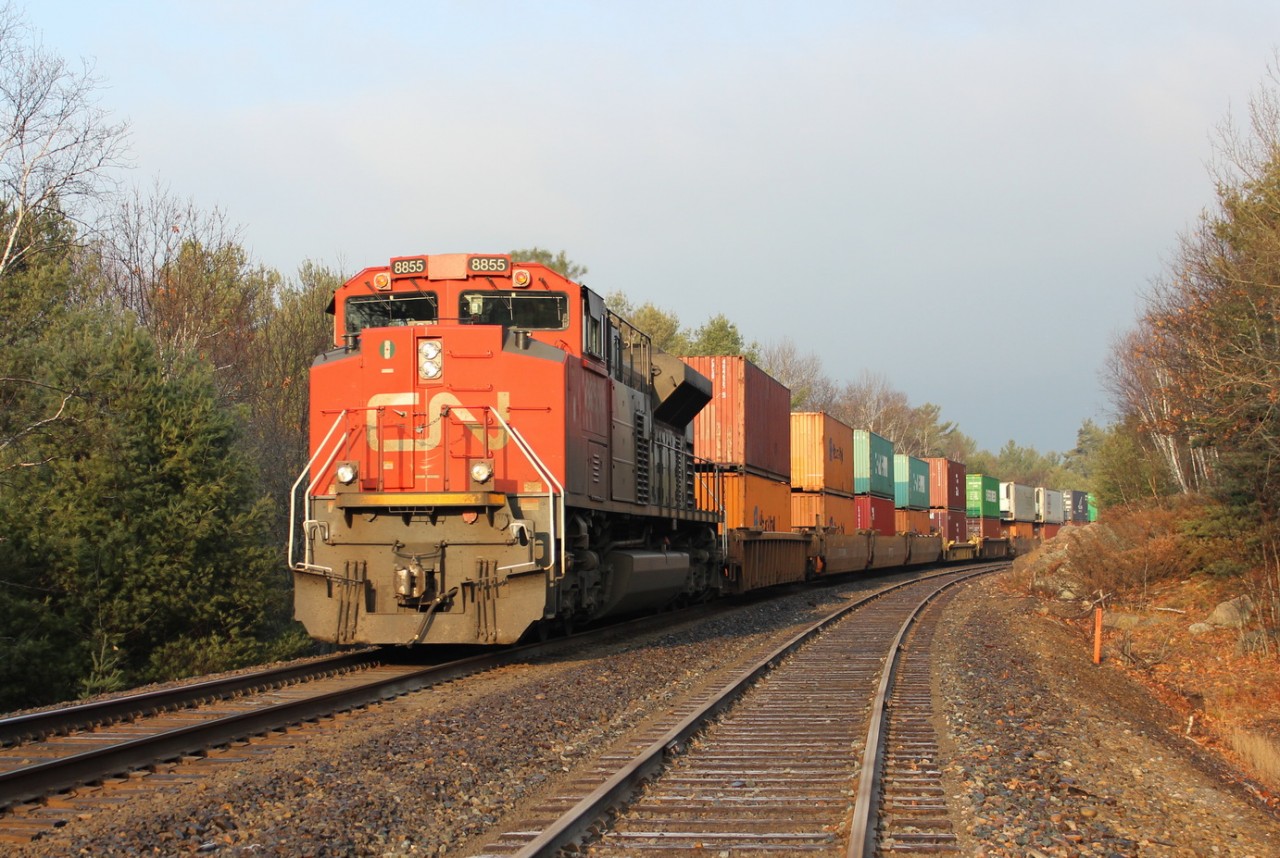 CN 8855 shoves on the rear on a long westbound intermodal train.