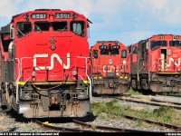 <B>The CN EMD family!</B> An EMD trio sits in the CN Southwark yard under the sunset. From left to right, CN 9591 (EMD GP40-2LW) and CN 4717 (EMD GP38-2) are waiting the next job. CN 5742 (EMD SD75I) leads the CN 309 from CN Joffre yard in Charny, QC.