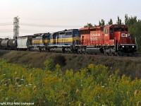 A late in the day eastbound leaves few options in terms on shooting, so a short, south facing straight section of an S-curve in north Ajax had to do (once pruned). The cloud was not part of the plan, but so goes the foam. CP 5010, DME 6071, and ICE 6426 lead 642's train east. The SD30C-ECO will be a most welcome break from those cursed toasters and waffle irons. 1902hrs.