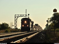 <B>CP 143 at golden hour!<B> In the sunrise, CP 143 breaks the morning silence in the small town of Saint-Polycarpe, Qc.