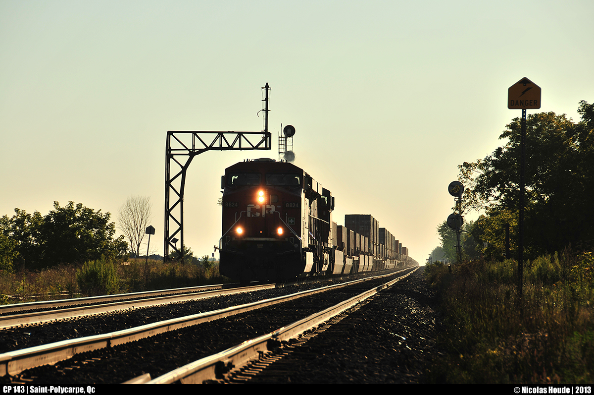 CP 143 at golden hour! In the sunrise, CP 143 breaks the morning silence in the small town of Saint-Polycarpe, Qc.