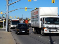 CN 580 is southbound on the Burford Spur paralleling lunch hour traffic on Clarence Street.