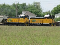   Just another day on the railway,  This crewman is enjoying the beautiful day as his train is coming back into Windsor. ETR 104 and ETR 107 are coupled together to bring this somewhat long transfer back from Ojibway.
