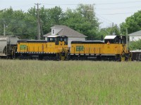   Just another day on the railway,  This crewman is enjoying the beautiful day as his train is coming back into Windsor. ETR 104 and ETR 107 are coupled together to bring this somewhat long transfer back from Ojibway.
