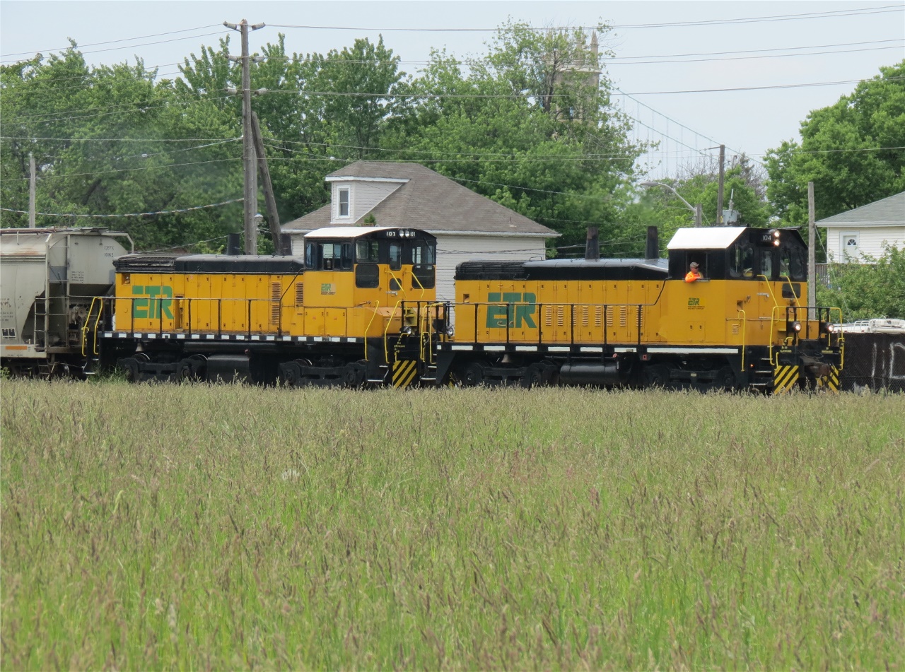 Just another day on the railway,  This crewman is enjoying the beautiful day as his train is coming back into Windsor. ETR 104 and ETR 107 are coupled together to bring this somewhat long transfer back from Ojibway.