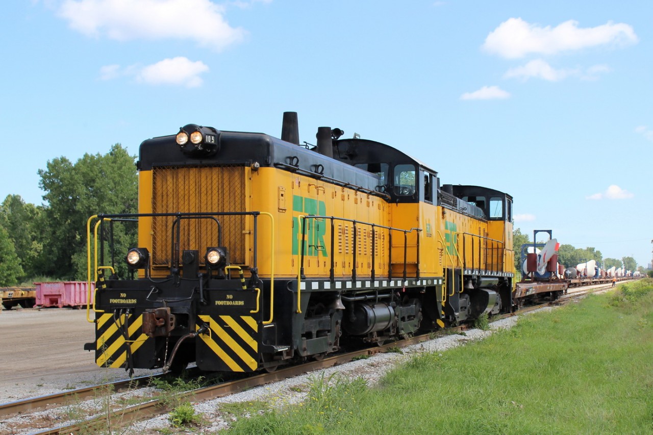 ETR 105 & ETR 107 haul a long train of windmill blades out of ojibway yard.