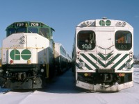 A near Christmas Saturday afternoon finds opposing ends of weekend stored GO Transit push-pull commuter equipment at CP Guelph Junction. GO GP40-2(W) 709 was built by GMD London in 1975. Following the introduction of F59PH’s she would be conveyed to Canadian National in 1991 and renumbered to CN 9676. The former GO unit continues in service to this day, currently in the province of Alberta. Note the brass bell above the cab windows. Cab control car 103 was constructed by Hawker Siddeley in 1967. Ultimately displaced by 200 series double deck cab cars, the remaining 100 series cars were sold the province of Quebec in 1994.