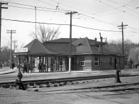 The Grand River Railway's Preston Junction Station. <br><br> This station was built in the late 1890's as a passenger loading point between the then three directions of the Galt, Preston & Hespeler passenger cars, and the new direction to Berlin of the Preston & Berlin Railway. Later it became a loading point also for the bus service of Canadian Pacific Transport. The canopy was removed after rail passenger service ended in 1955. Freight crews used the waiting room for lockers and storage, and the back room for signing in and off of assignments until all electrical rail services ceased on October 1st, 1961. The building was demolished in September 1962.  <br><br> Photo taken by Cecil Hommerding, from the collection (Copyright) of Doug Leffler. Substantial caption information provided by George Roth et al with much thanks. <br><br> <i><u>Other photos at Preston:</u></i><br> Passenger car passing through Preston: <a href="http://www.railpictures.ca/?attachment_id=10942"><b>http://www.railpictures.ca/?attachment_id=10942</b></a><br> GRR's Preston Shops: <a href="http://www.railpictures.ca/?attachment_id=10413"><b>http://www.railpictures.ca/?attachment_id=10413</b></a><br> Car 848 at Preston: <a href="http://www.railpictures.ca/?attachment_id=10298"><b>http://www.railpictures.ca/?attachment_id=10298</b></a><br> <br>  For more details on Cecil, see <a href="http://www.railpictures.ca/?attachment_id=10297"><b>here</b></a>.
