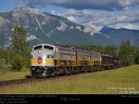  With glorious skies above and the Canadian Rockies as a backdrop, CP's Royal Canadian Pacific with F units 4107-1900-4106 are about to pass the MP 65 marker on CP's Cranbrook Subdivision as they make their way to Cranbrook BC for their overnight stay before continuing on to Golden the following day.