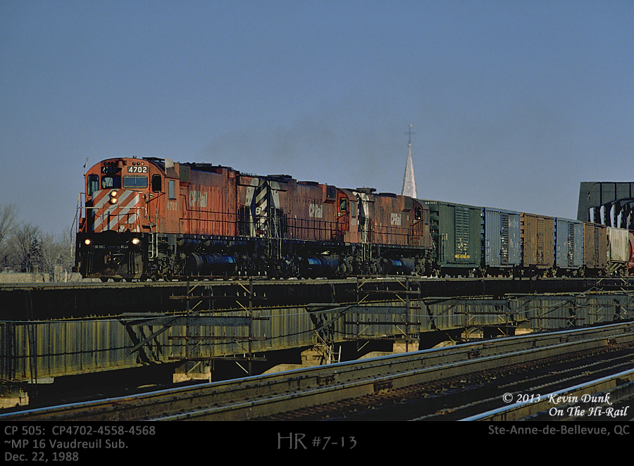 Train CP 505 is seen busting loose with 3 big M-Liners CP 4702-4558-4568 as it crosses the bridge westbound at Ste-Anne-de-Bellevue, Quebec.