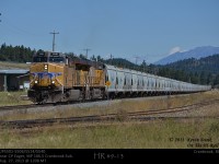 UP5501-5506 with mid-train DPU UP5514 and rear DPU UP5540 are seen passing the old Crestbrook mill site as they haul loaded potash through Cranbrook, BC bound for Portland Oregon.