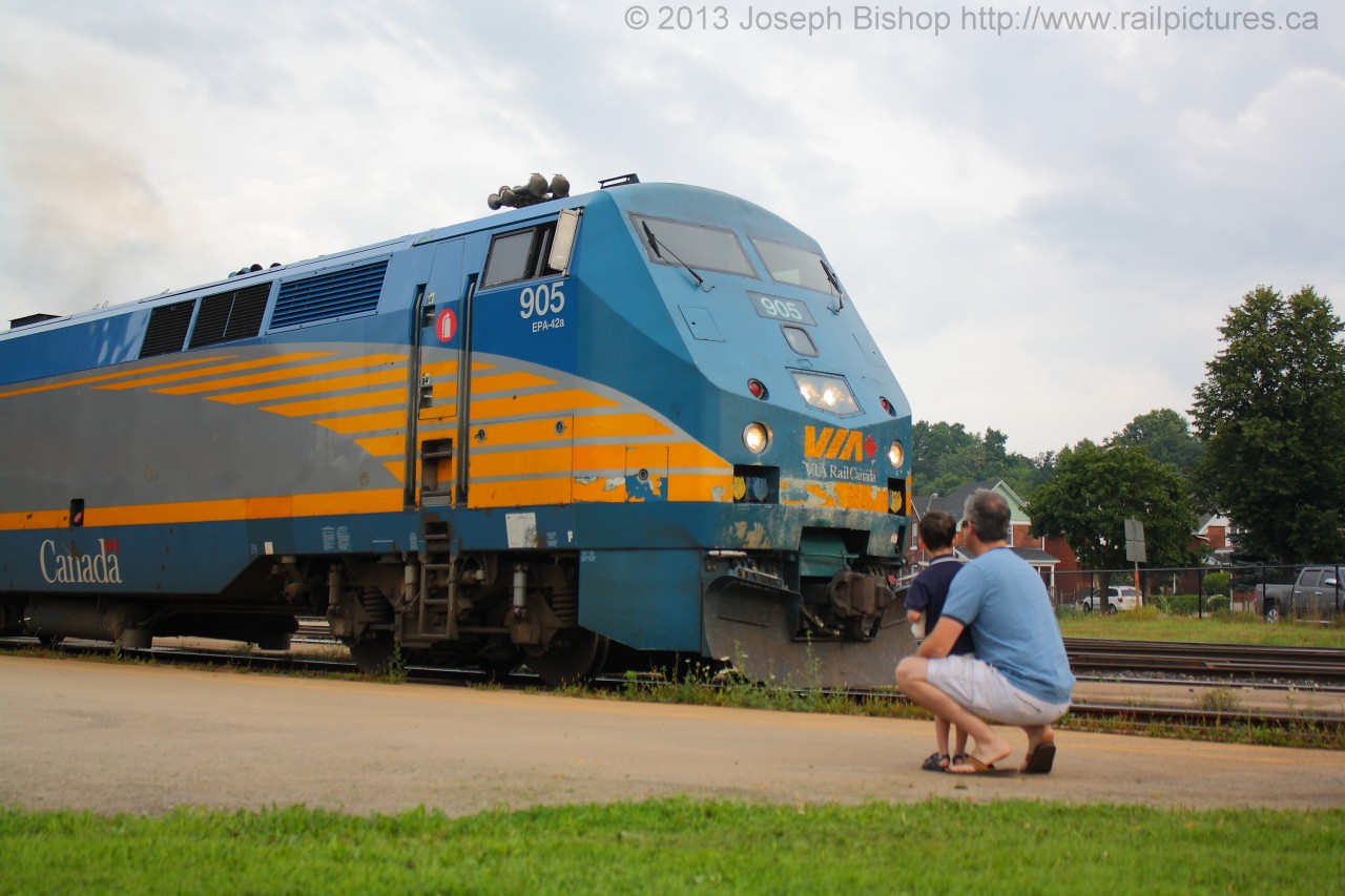 As Via 70 departs Brantford a young boy and his father watch from on the platform.