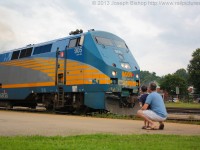 As Via 70 departs Brantford a young boy and his father watch from on the platform.  