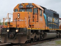 ONT 1735 leads a two car cyanide train through Englehart.  The train is heading North for use in mining.