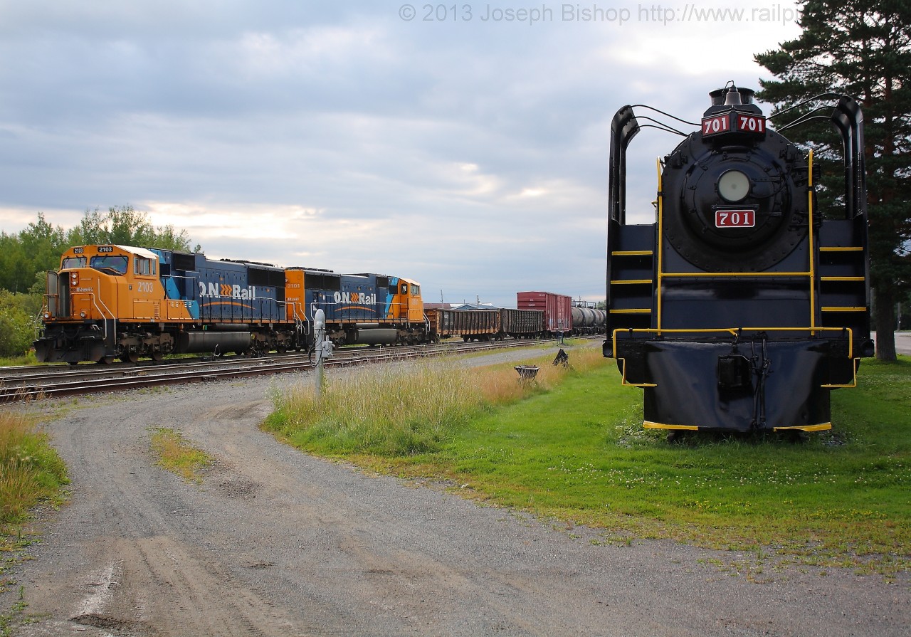 ONR 113 has entered the yard at Englehart with ONT 2103 and ONT 2101.  TNO 701 sits on a piece of track alongside the yard.