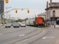CN 580 pauses at the stop lights alongside cars on Clarence street.  They are making their weekly trip down the Burford Spur to Ingenia with 2 cars.  This was my first time shooting 580 on the Burford.