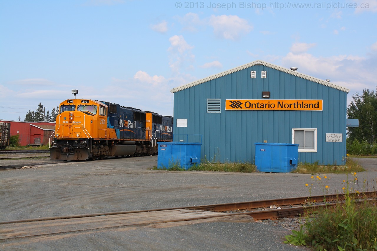 ONT 2101 and 2103 rest beside the shop at Englehart Ontario.  They arrived on train 113 a few minutes ago from North Bay and will head North on train 211 later that day.  I would catch them again at Boston Creek Ontario.