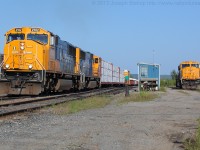 ONT 2102 and ONT 2101 notch up getting Southbound train 214 under way out of Englehart as ONT 2103 watches from the RIP track at the shops.  