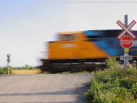 ONT 2104 gets train 207 under way out of the North end of Englehart yard. <br> Shutter Speed:1/5 sec FStop: 22 ISO: 100