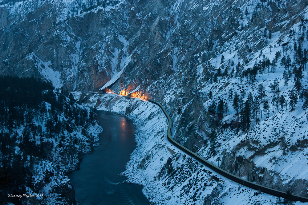 During blue hour a westbound CP sulphur train streaks through the White Canyon on CNs Ashcroft Sub, east of Lytton, BC.