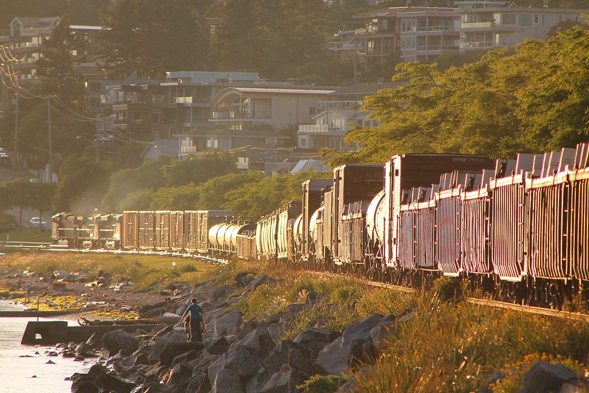 With some nice evening light and shiny BNSF engines, a Westbound BNSF mixed freight heads up the New Westminster subdivision near White Rock heading just about 15 mins after the Amtrak Cascades passed.