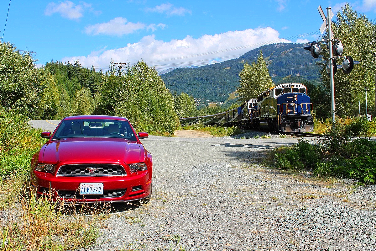 The Whistler Sea To Sky climb Rocky Mountaineer heads south on the Canadian National Squamish subdivision near Whistler. Thanks goes to the crew for the huge friendly wave!