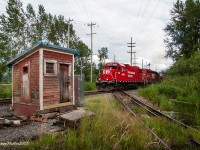 Departing the Clayburn diamond in Abbotsford, BC, CPs Sumas Turn passes over the diamond shared with Southern Railway of BC. To the left is the hut that was used to activate the semaphore signals that have been decommissioned. Since this image was taken the hut has been removed and has been donated to the Fraser Valley Heritage Railway that operates the Interuban between Cloverdale, BC and Sullivan. 