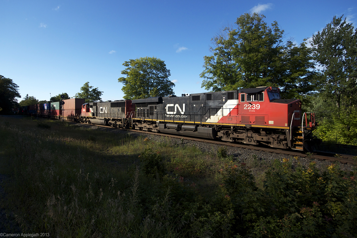 CN Q102 powers through Dock Siding, beside Lake Joseph.

(I from Toronto and I uploaded a photo, does that make me good yet?)