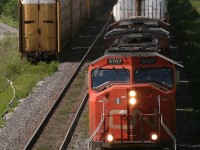 Q148 led by 5707-2281, passes under the bridge by the cement plant in Beachville.