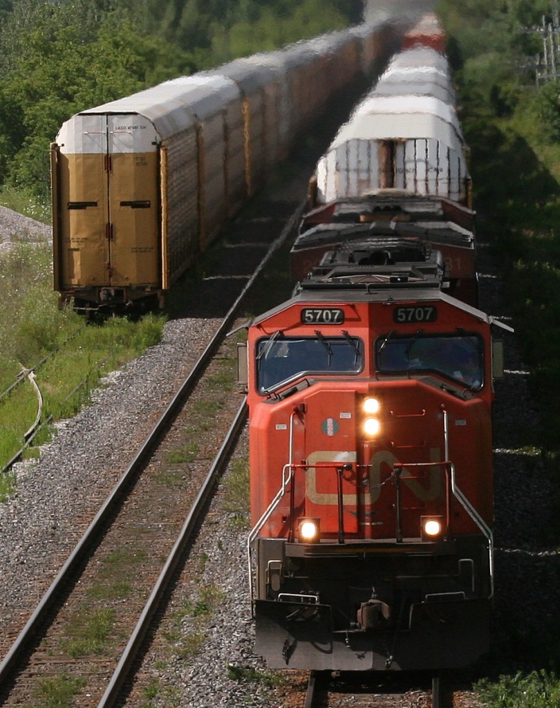 Q148 led by 5707-2281, passes under the bridge by the cement plant in Beachville.