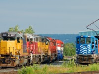OVR power parked behind the shop consisting of LLPX 2221, GEXR 3835, LLPX 2241, a CP SD40-2, RLK 4096, CEFX 2028, CEFX 2024? and RMPX 9426