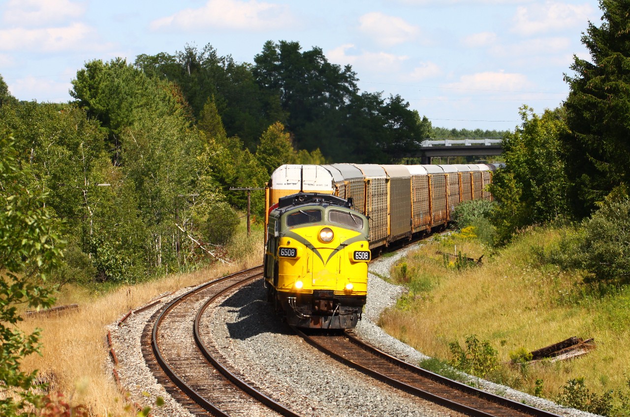 The OSR's Ingersoll-Woodstock turn has lifted 21 empty multi-levels for the Cami plant and makes their way west out of Coakley. Where else can you see an F-unit operating in regular freight service on a class 1? Way cool!