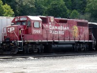 CP inspection train led by ex Delaware and Hudson GP38-2 7309 lays over at Hamilton's Kinnear Yard.Her consist included Accomodation car 68,Gauge Restraint Measurement Vehicle 424993 and Track Evaluation observation car 63. 