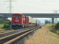 <b>The rumours of my death have been greatly exaggerated..</b> and the SD60's are back! A triplet do the honours of hauling the Expressway between Milton, Ontario and Montreal, QC on August 20. Today's train was CP 6262, 6251, 6248. 6251 was just released from CAD where the rebuilding program continues, and 6248 was also released directly to storage in August making this one of the first revenue runs for the pair.<br><br>Train 142 is waiting in the background, as 132 has to double onto both cuts of Expressway cars in the yard and set the SBU before departing east.
