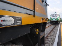 <b>Builders Plate</b> for VIA 6455 is focused -  while a GO train (209) sits parked on the main just fifty feet away. Due to a recent violent storm, downed trees blocked the main just around the curve (the Cab car was almost touching branches with no room to head any further west!), both trains had to receive permission to approach within visual distance of each other. Passengers got off at Guelph and anyone heading west was transferred to a bus. 

