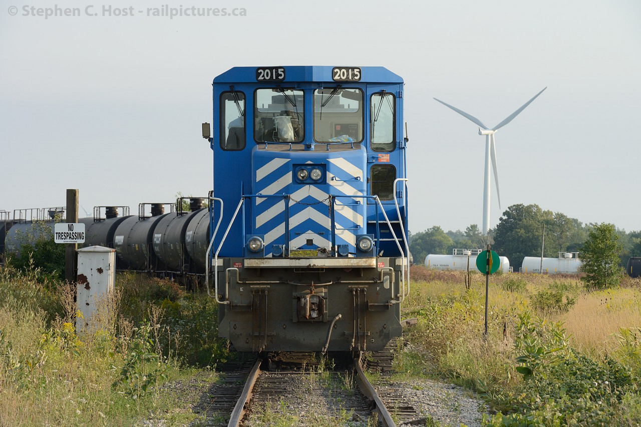 Only a couple months since Windmill trains traversed the SOR, we find the fruits of their labour having been constructed and put into service, while the daily northbound/westbound train waits for a crew.