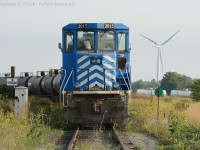 Only a couple months since Windmill trains traversed the SOR, we find the fruits of their labour having been constructed and put into service, while the daily northbound/westbound train waits for a crew. (The switchstand seems inadequate with such a large object in the background, doesn't it?)