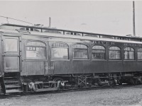 Grand River Railway 828 was built locally, by the Preston Car & Coach Company, in 1912.  Employed in its later years primarily on the short run between Preston and Hespeler, it was converted to a work service car soon after this photo was taken at Preston yard.  828 was broken up in 1953.  